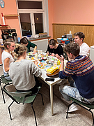 A group of students bakes christmas cookies together at the Cosmo Club Christmas Cookie Baking Event