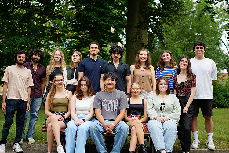 Cosmopolitan Team 2025 standing together in front of a big tree