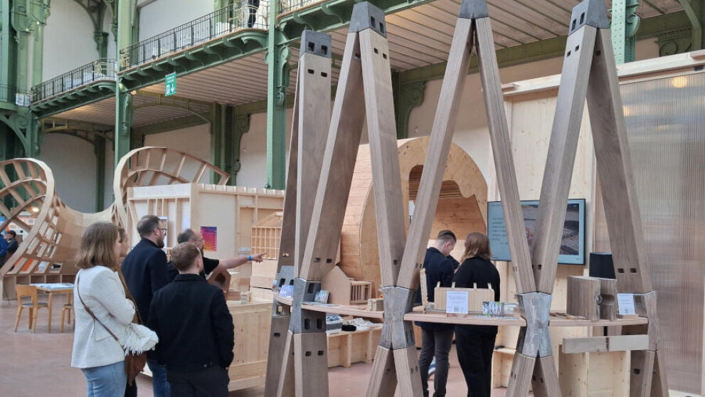 Visitors look at a section of the tower’s scaffolding