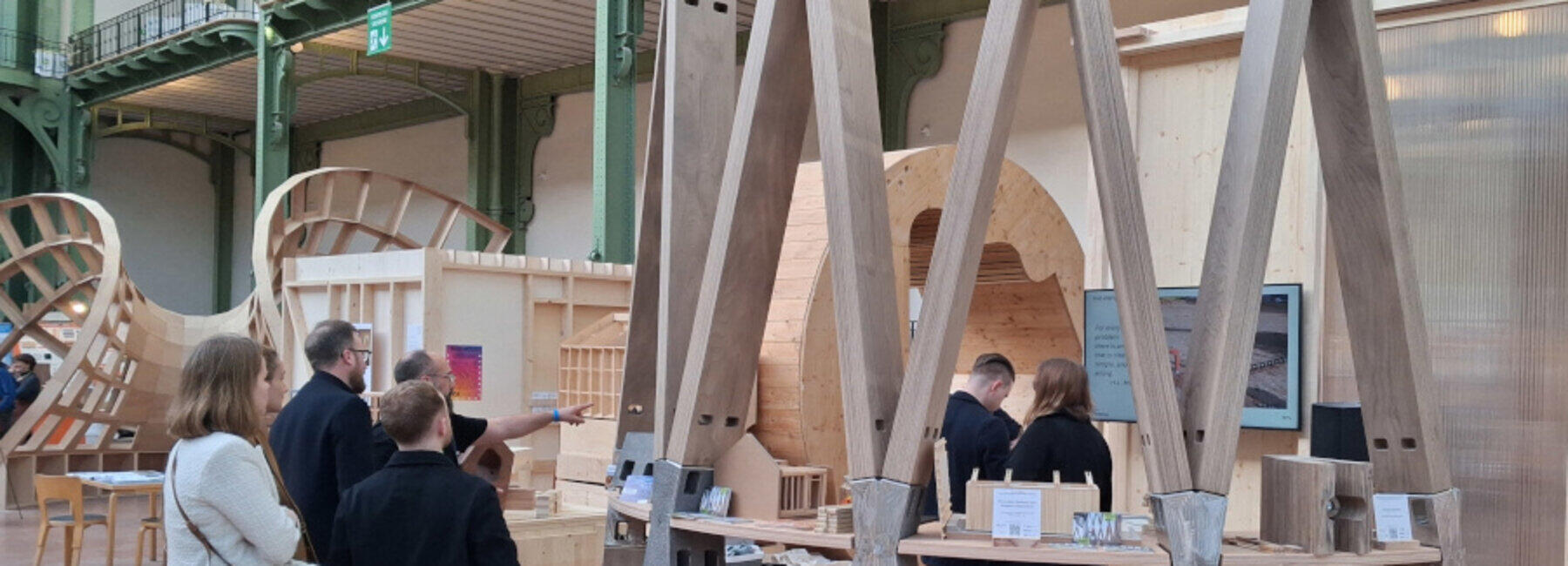 Visitors look at a section of the tower’s scaffolding