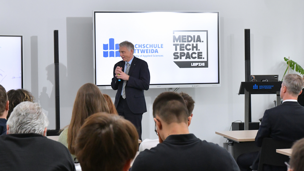 The Vice-Chancellor of Mittweida University of Applied Sciences welcomes the guests to the MediaTechspace in Leipzig