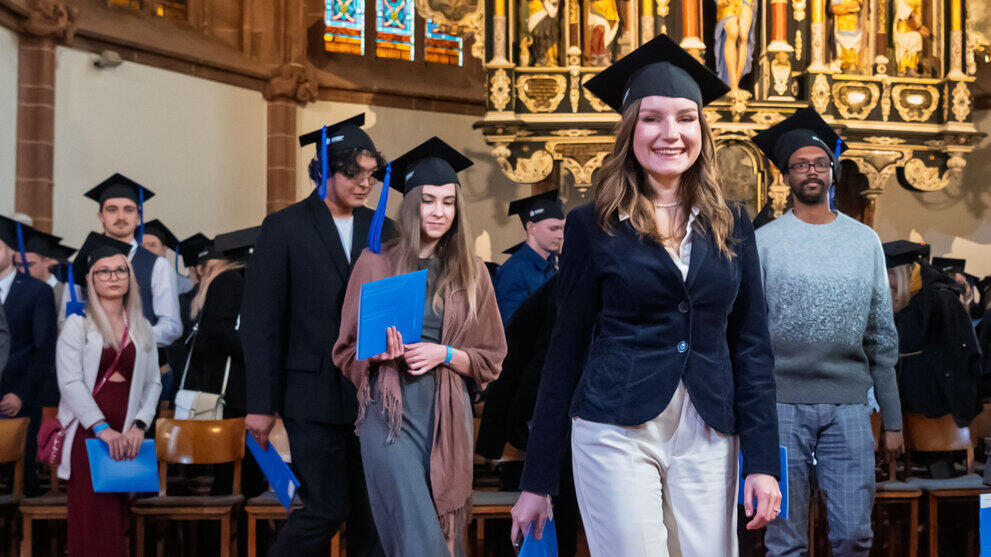 The graduates leave the chancel.