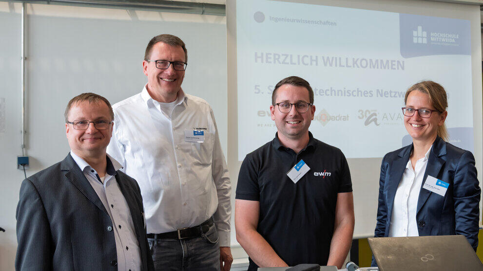 Portraitbild von vier Personen