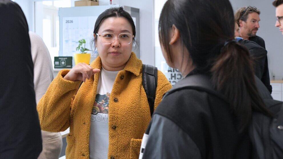 Two students are chatting.