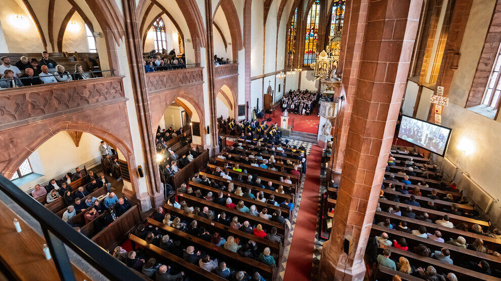 A view from above across the packed nave towards the chancel.