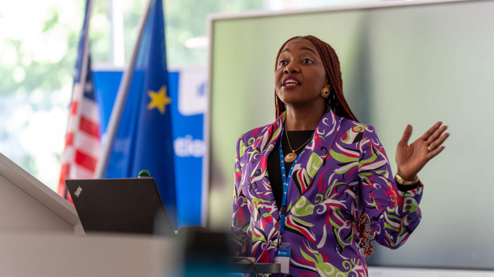 A black woman at the lectern.